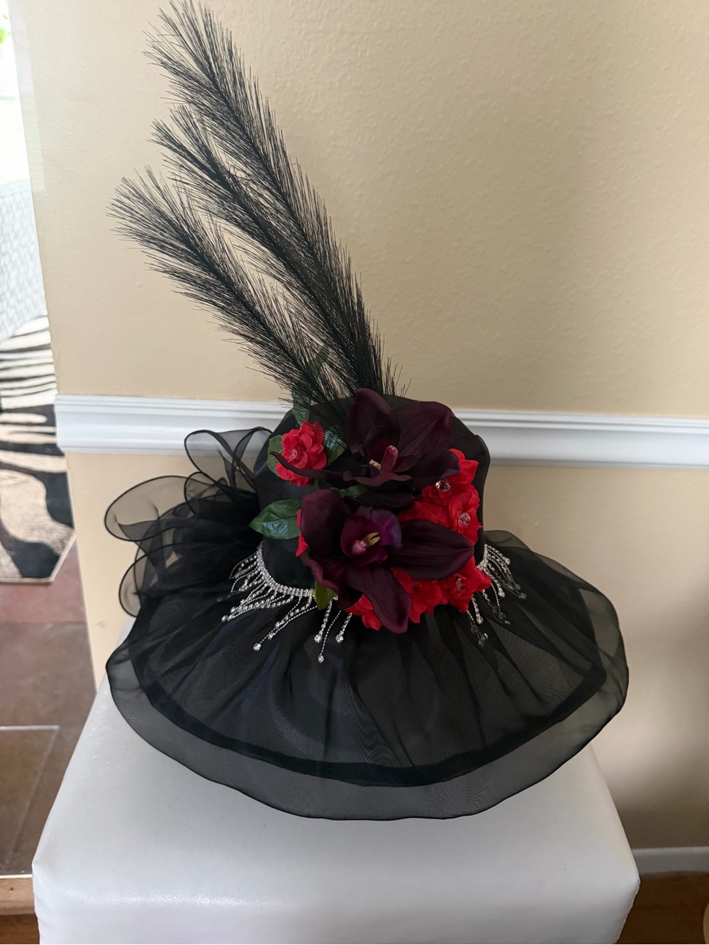 Elegant Black Fascinator Hat with Red Floral Accent